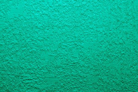 Blue cement wall,Rough surface look like blue sand.Background texture design. Green cement wall...