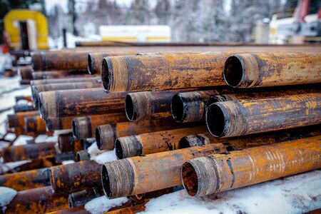 Oil Drill pipe. Rusty drill pipes were drilled in the well section. Downhole drilling rig. Laying...