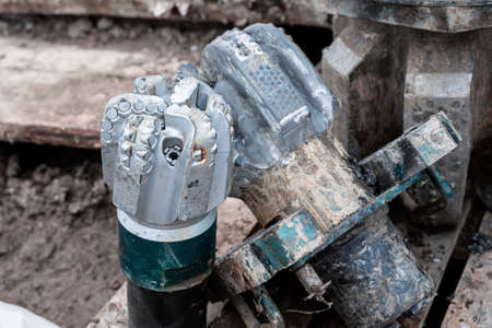 Close up view on drill bit roller cutter for drilling machines and equipment for oil and gas...