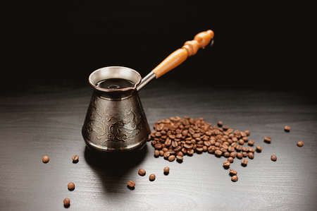 Coffee Pot And Coffee Beans On Dark Backgroundの写真素材