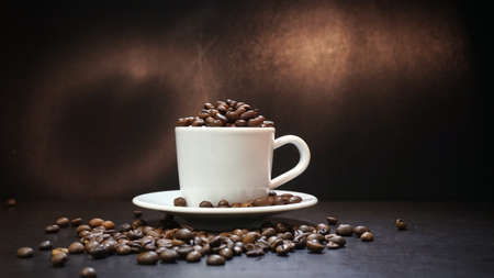 Cup With Coffee Beans Isolated on Black Background.の写真素材