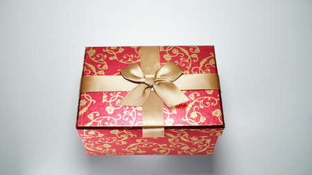Red gift box on white background.