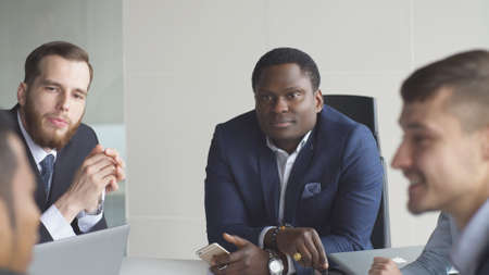 Multi-ethnic business team meeting brainstorming sharing new ideas.