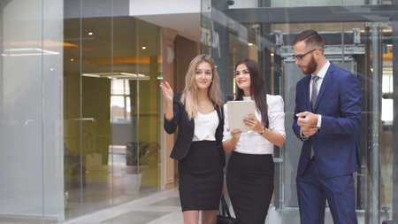 Group of business people using tablet computer during a meeting.