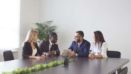 Meeting between business people on a tableの写真素材