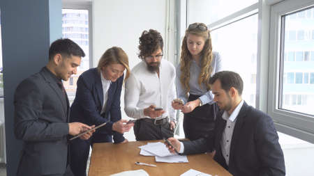 Working atmosphere in the office. Group of business people discussing business issues