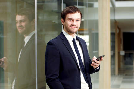 Portrait of confident businessman in modern office