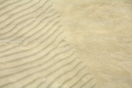 texture of the sand in the water 