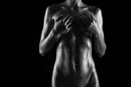 naked female body on a black backgroundの写真素材