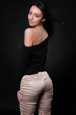 Young sensual model girl pose in studioの写真素材