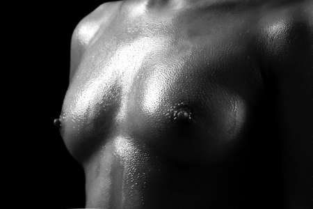 naked female body on a black backgroundの写真素材
