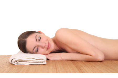 beautiful young girl lying in a spaの写真素材