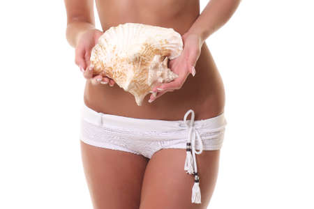 white knitted underwear on beautiful young woman's body. on a white backgroundの写真素材