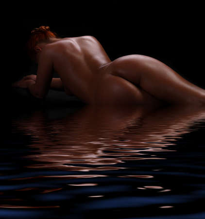 back and butt naked women.on a black backgroundの写真素材