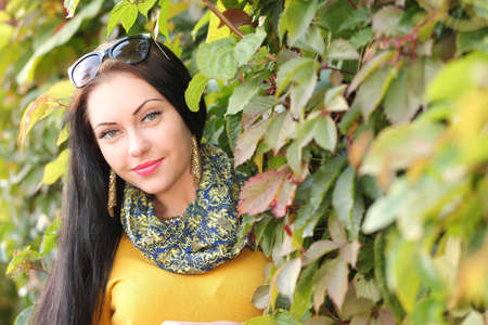 young beauty girl in the park in autumnの写真素材