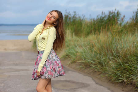 girl with a light summer dress outdoors on a summer dayの写真素材