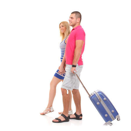 happy young woman and a man with a suitcase for travelの写真素材