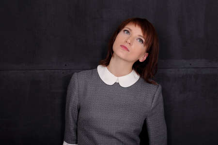 Young serious woman in a business dress