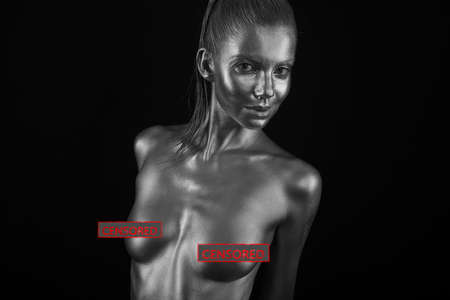 naked female body in a silver body painting. Censored versionの写真素材
