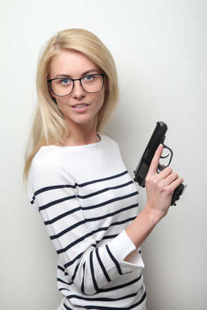 beautiful sexy girl holding gunの写真素材