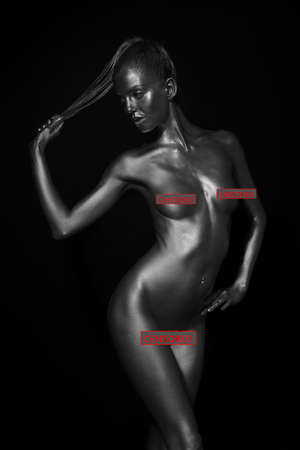 naked female body in a silver body painting. Censored versionの写真素材