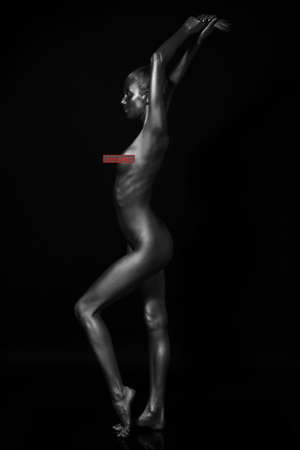naked female body in a silver body painting. Censored versionの写真素材