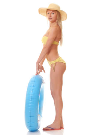 sexy female in bikini holding swimming ringの写真素材