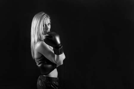 young beautiful woman with the boxing glovesの写真素材