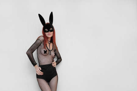 Sexy naked model with a black rabbit maskの写真素材