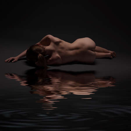 young sexy naked girl on a dark backgroundの写真素材