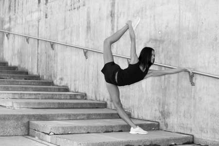 Young attractive female fitness woman performing a twineの写真素材