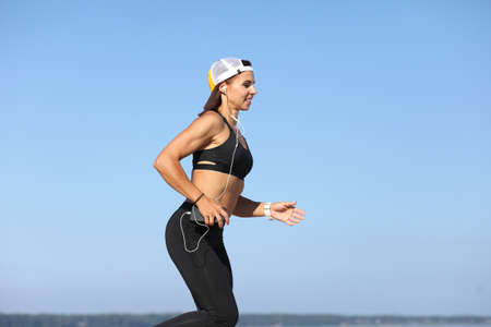 Young strong athletic girl holds a workoutの写真素材