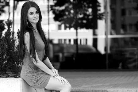 photo of a young fashionable girl in the cityの写真素材