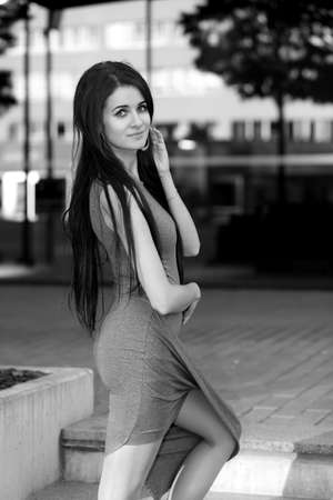 photo of a young fashionable girl in the cityの写真素材