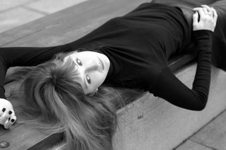 photo of a young fashionable girl in the cityの写真素材