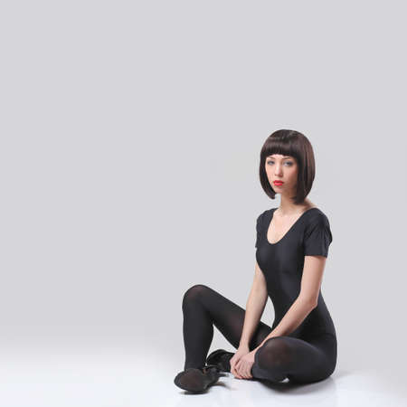 Beautiful woman posing in hosiery and heels on white background.の写真素材