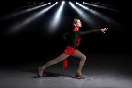 beautiful girl figure skater dancing on the iceの写真素材