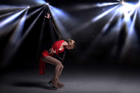 beautiful girl figure skater dancing on the iceの写真素材