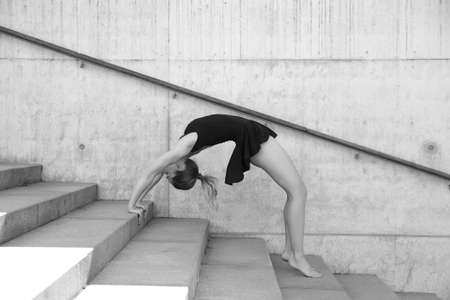 Young athletic girl with good flexibility and stretchingの写真素材