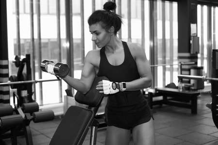 Fitness young sexy girl in the gym doing exercisesの写真素材