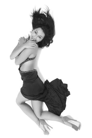 young girl in a black dress on a white backgroundの写真素材