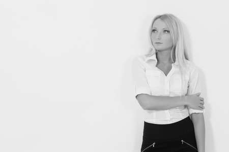 Beautiful girl in jeans and a T-shirt . Black and white photo