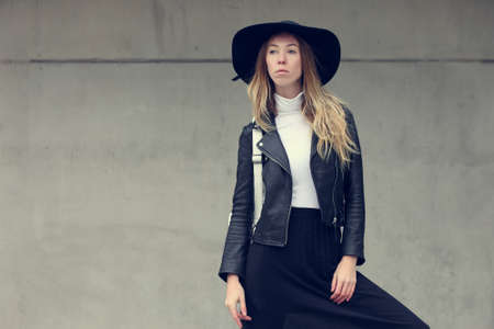 Woman in urban background wearing casual clothes