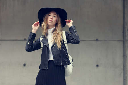 Woman in urban background wearing casual clothes