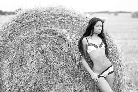 fashion outdoor photo of gorgeous sexy woman in elegant lingerie posing outdoorの写真素材