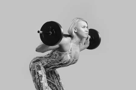 Fitness young girl doing exercises black and white photoの写真素材