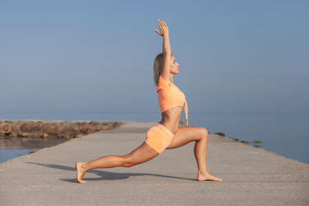 healthy young slim woman practising yoga exerciseの写真素材