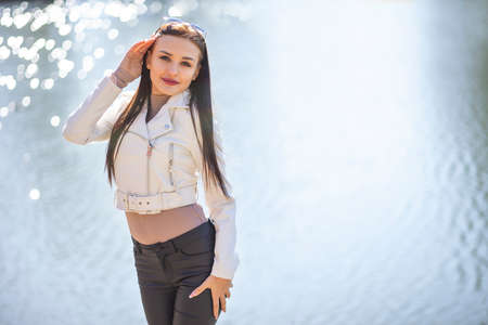 beauty young slim fashion model posing on the streetの写真素材