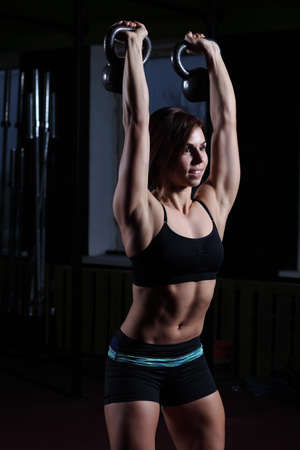 fitness Kettlebells swing exercise woman workout at gymの写真素材