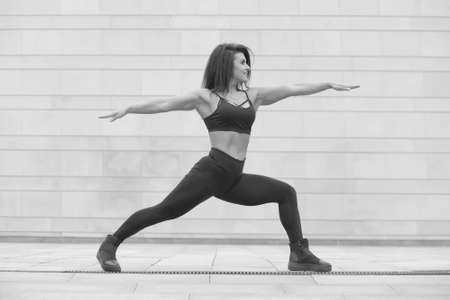 young strong muscular slim girl doing exercisesの写真素材